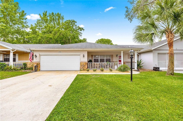 8874 SW 95th St Unit E, Ocala, FL 34481 - ranch-style home featuring covered porch, a garage, a front yard, stucco siding, and concrete driveway