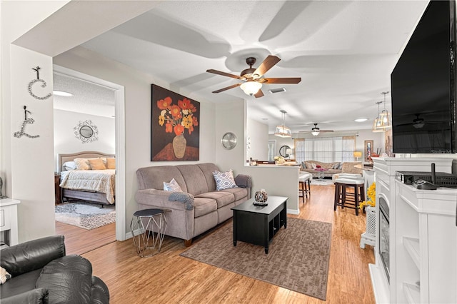 8874 SW 95th St Unit E, Ocala, FL 34481 - living area featuring a ceiling fan and light wood-type flooring
