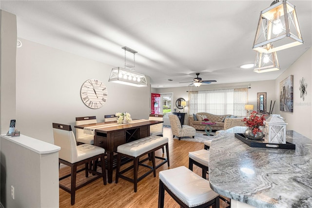 8874 SW 95th St Unit E, Ocala, FL 34481 - dining space with light wood-type flooring and a ceiling fan
