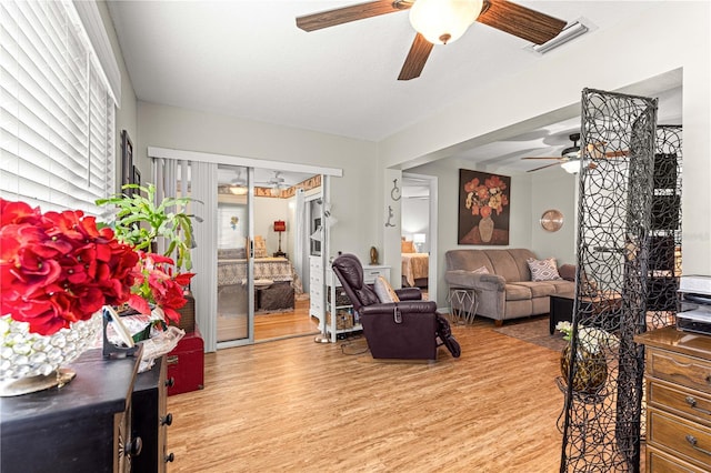8874 SW 95th St Unit E, Ocala, FL 34481 - living area with a ceiling fan and wood finished floors