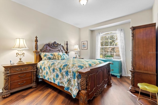 bedroom featuring dark wood-style flooring