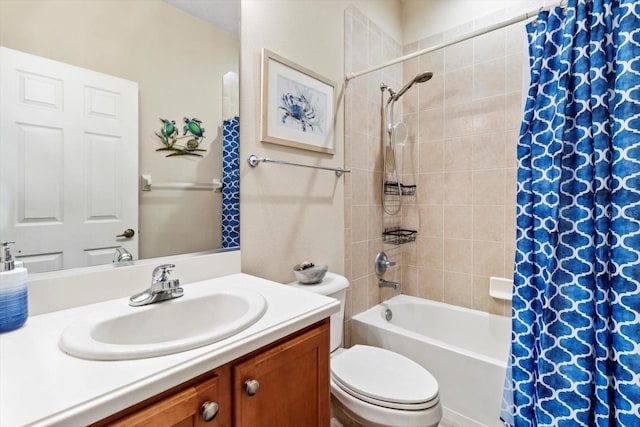 bathroom with shower / bathtub combination with curtain, toilet, and vanity