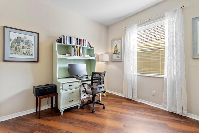 office space featuring dark wood-type flooring and baseboards