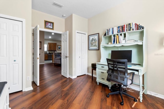 office area with wood finished floors and baseboards