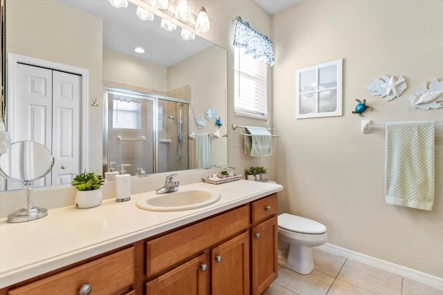 bathroom with healthy amount of natural light, vanity, tile patterned floors, and a stall shower