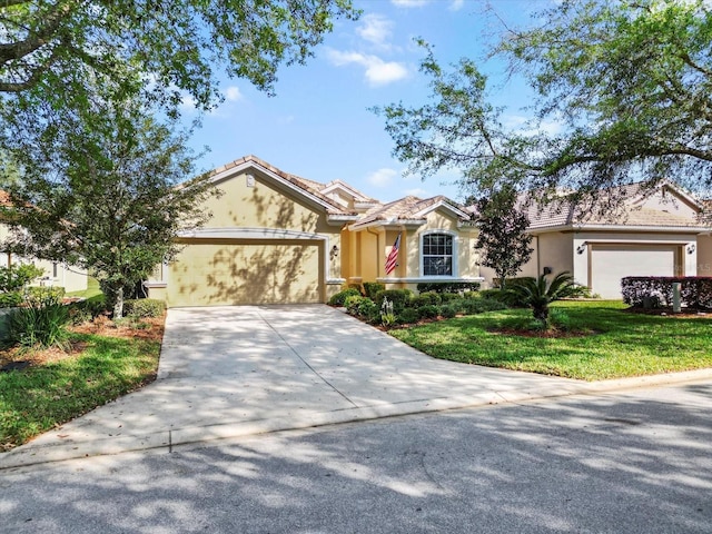 ranch-style home with a garage, concrete driveway, stucco siding, and a tile roof