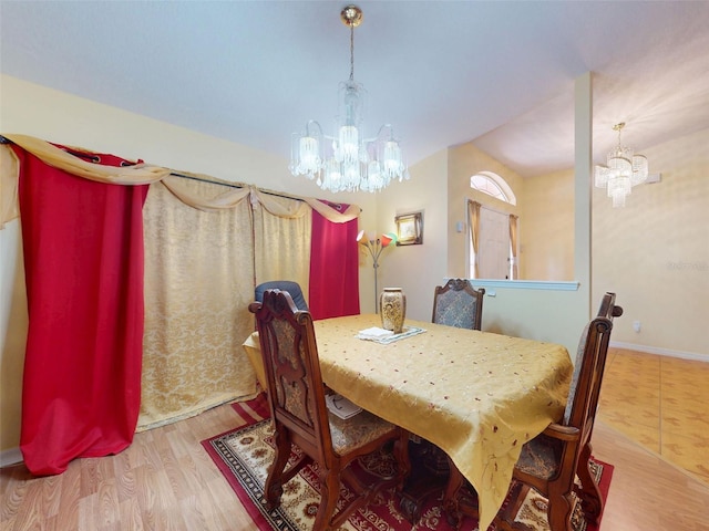 9325 SW 125th Court Rd, Dunnellon, FL 34432 - dining area featuring a chandelier, wood finished floors, and baseboards