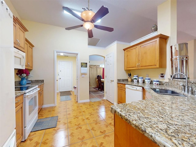 9325 SW 125th Court Rd, Dunnellon, FL 34432 - kitchen featuring white appliances, a sink, a ceiling fan, light stone counters, and arched walkways