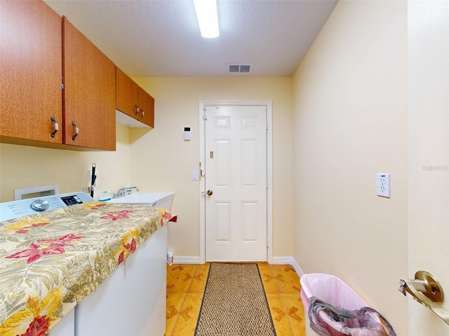 9325 SW 125th Court Rd, Dunnellon, FL 34432 - laundry area with cabinet space, washer hookup, and baseboards