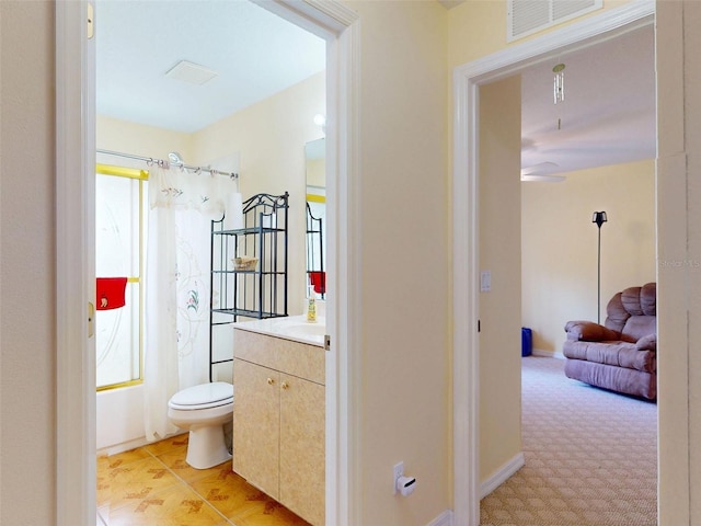 9325 SW 125th Court Rd, Dunnellon, FL 34432 - bathroom with vanity, toilet, and ceiling fan