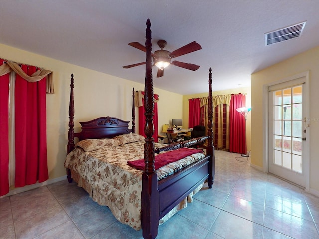 9325 SW 125th Court Rd, Dunnellon, FL 34432 - tiled bedroom with ceiling fan and baseboards