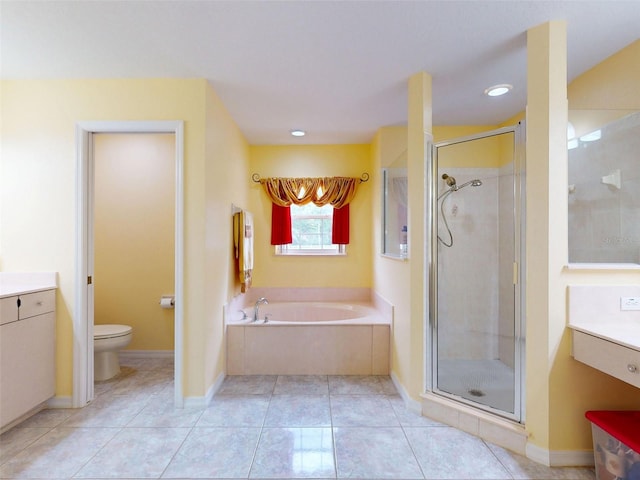 9325 SW 125th Court Rd, Dunnellon, FL 34432 - full bathroom with vanity, a bath, a stall shower, toilet, and recessed lighting