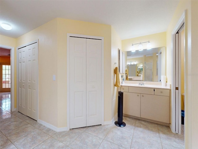 9325 SW 125th Court Rd, Dunnellon, FL 34432 - bathroom with a closet, vanity, toilet, baseboards, and tile patterned flooring