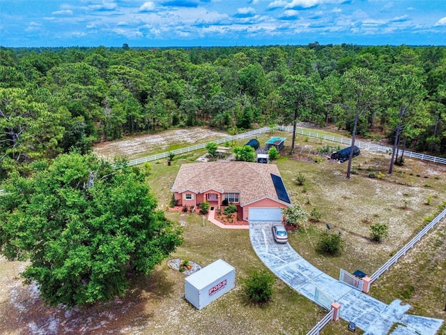 9325 SW 125th Court Rd, Dunnellon, FL 34432 - view from above of property with a heavily wooded area
