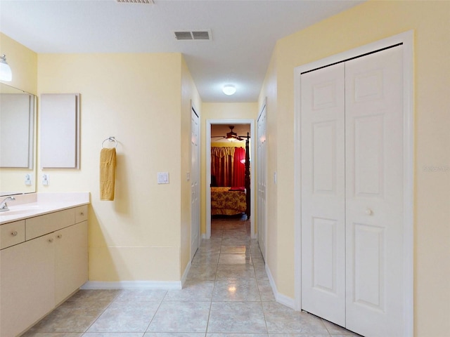 9325 SW 125th Court Rd, Dunnellon, FL 34432 - full bath featuring vanity, baseboards, and tile patterned flooring