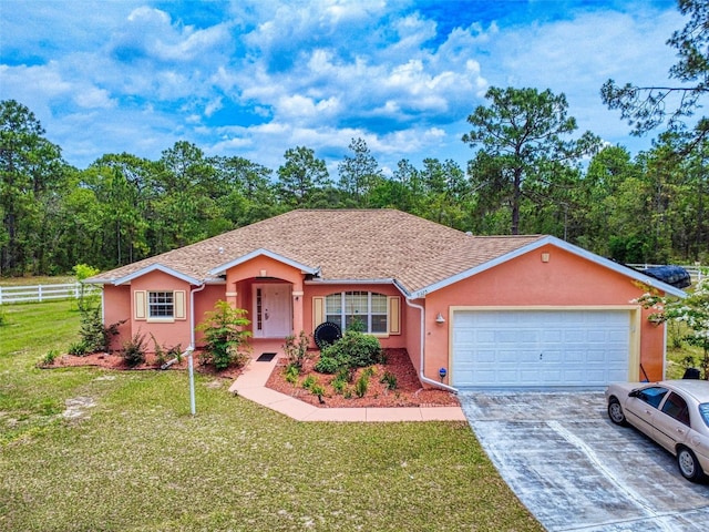 9325 SW 125th Court Rd, Dunnellon, FL 34432 - ranch-style house featuring driveway, an attached garage, stucco siding, and a shingled roof