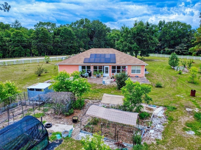 9325 SW 125th Court Rd, Dunnellon, FL 34432 - back of house with solar panels and stucco siding