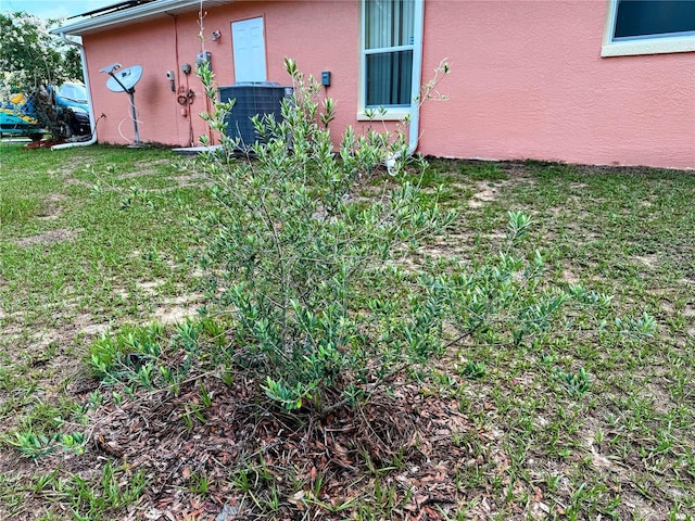 9325 SW 125th Court Rd, Dunnellon, FL 34432 - view of grassy yard featuring central air condition unit