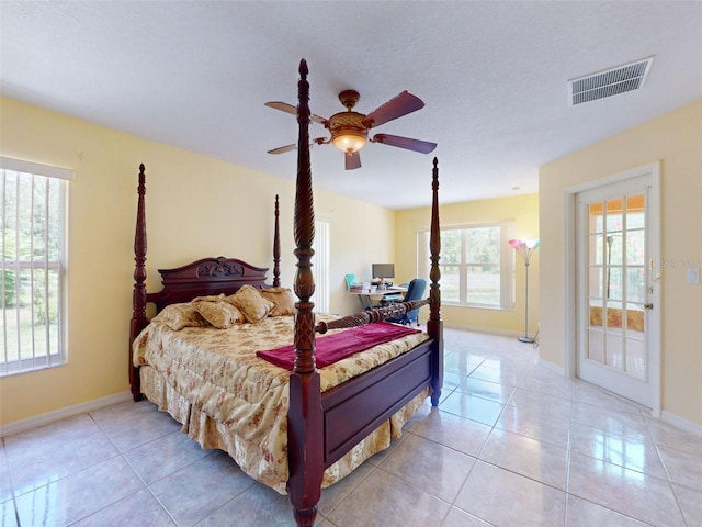 9325 SW 125th Court Rd, Dunnellon, FL 34432 - bedroom featuring light tile patterned flooring and a ceiling fan