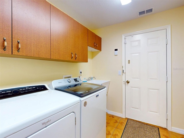 9325 SW 125th Court Rd, Dunnellon, FL 34432 - laundry room featuring washer and clothes dryer and cabinet space
