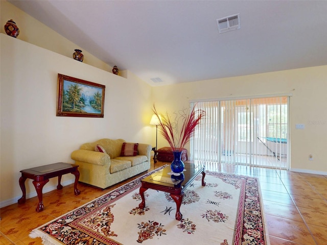9325 SW 125th Court Rd, Dunnellon, FL 34432 - living room featuring lofted ceiling and light tile patterned flooring