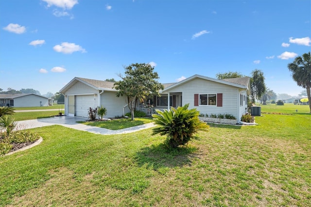 17915 SE 102nd Ter, Summerfield, FL 34491 - ranch-style home featuring cooling unit, concrete driveway, a front lawn, and a garage