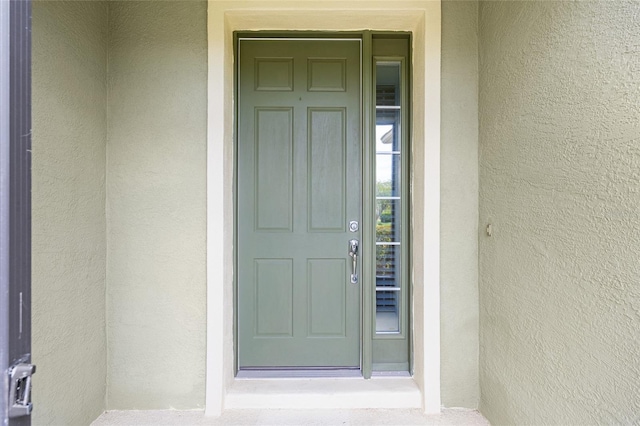6651 SW 93rd Ct, Ocala, FL 34481 - doorway to property with stucco siding