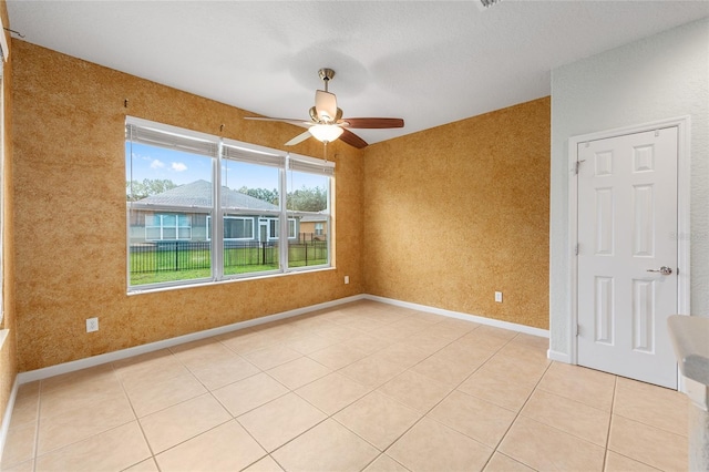 6651 SW 93rd Ct, Ocala, FL 34481 - unfurnished room with ceiling fan, light tile patterned floors, and baseboards