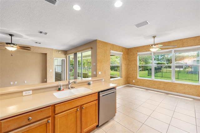 6651 SW 93rd Ct, Ocala, FL 34481 - kitchen featuring stainless steel dishwasher, a sink, ceiling fan, a textured ceiling, and light countertops