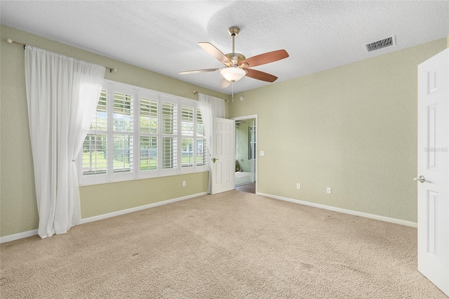 6651 SW 93rd Ct, Ocala, FL 34481 - unfurnished bedroom featuring carpet, baseboards, a ceiling fan, and a textured ceiling