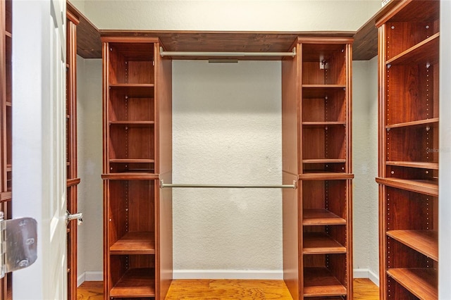6651 SW 93rd Ct, Ocala, FL 34481 - walk in closet featuring wood finished floors