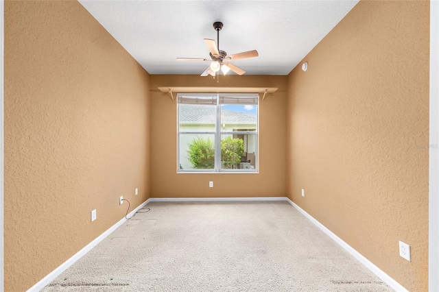 6651 SW 93rd Ct, Ocala, FL 34481 - empty room with a textured wall, a ceiling fan, light carpet, and baseboards