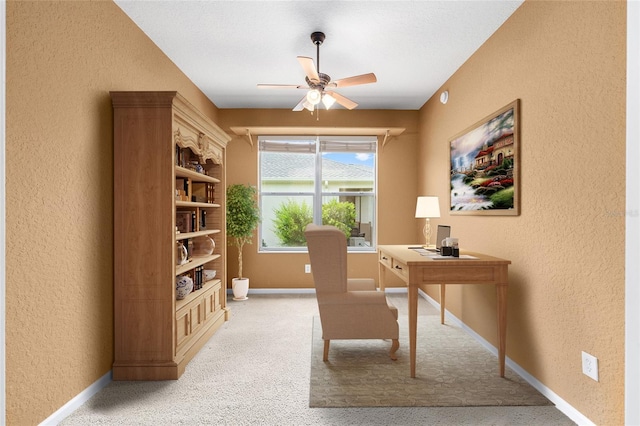 6651 SW 93rd Ct, Ocala, FL 34481 - office area featuring a textured wall, ceiling fan, baseboards, and light carpet