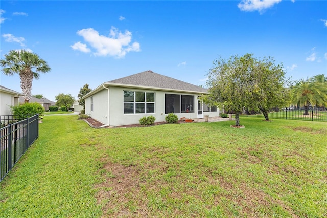 6651 SW 93rd Ct, Ocala, FL 34481 - rear view of property with stucco siding and a sunroom