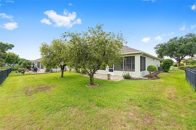 6651 SW 93rd Ct, Ocala, FL 34481 - view of yard with a sunroom and cooling unit
