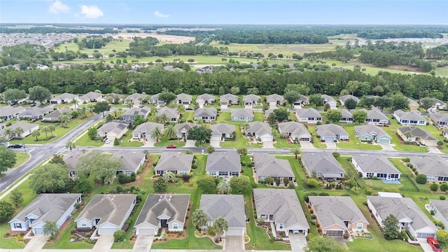 6651 SW 93rd Ct, Ocala, FL 34481 - aerial overview of property's location with nearby suburban area and a tree filled landscape