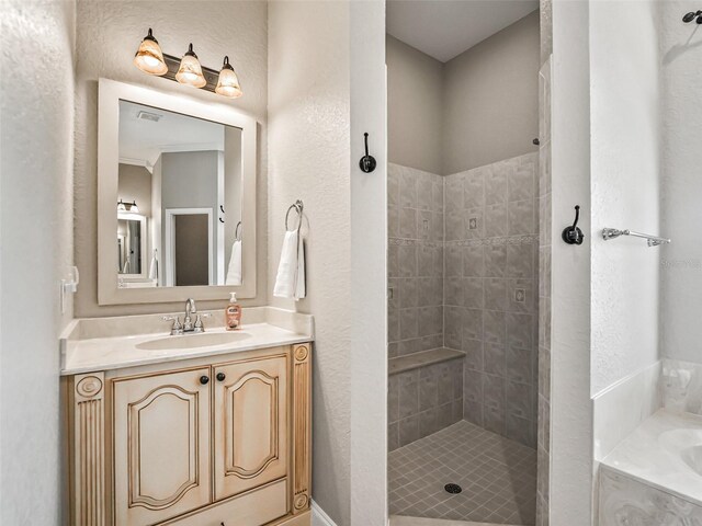 2540 NE 120th St, Anthony, FL 32617 - full bath featuring a garden tub, vanity, tiled shower, and a textured wall