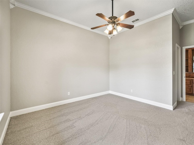 2540 NE 120th St, Anthony, FL 32617 - unfurnished room featuring crown molding, carpet floors, baseboards, and ceiling fan