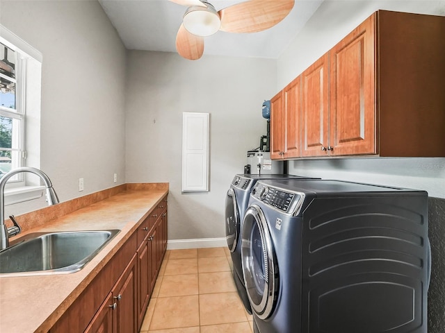 2540 NE 120th St, Anthony, FL 32617 - laundry area featuring washer and dryer, cabinet space, light tile patterned floors, baseboards, and a ceiling fan