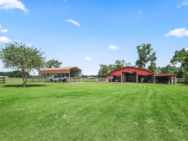 2540 NE 120th St, Anthony, FL 32617 - view of yard featuring a pole building, an outbuilding, and a view of countryside