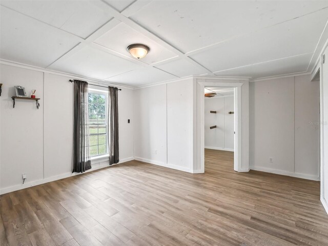 2540 NE 120th St, Anthony, FL 32617 - spare room featuring wood finished floors, baseboards, coffered ceiling, and crown molding