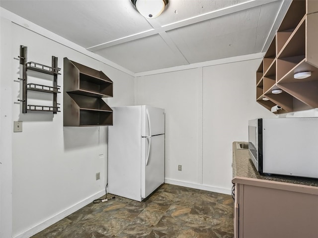 2540 NE 120th St, Anthony, FL 32617 - interior space featuring freestanding refrigerator, stainless steel microwave, open shelves, wall chimney exhaust hood, and stone finish flooring