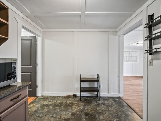 2540 NE 120th St, Anthony, FL 32617 - interior space featuring baseboards and coffered ceiling