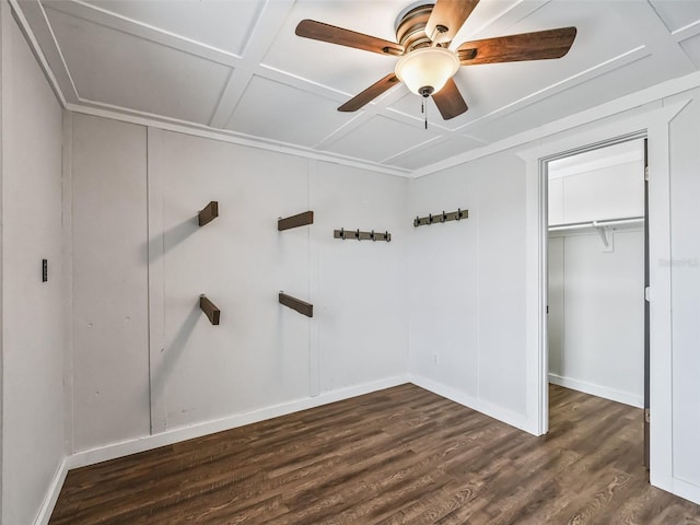 2540 NE 120th St, Anthony, FL 32617 - unfurnished bedroom featuring baseboards, dark wood-type flooring, ceiling fan, a closet, and coffered ceiling