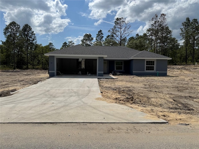view of front of property featuring driveway and a garage