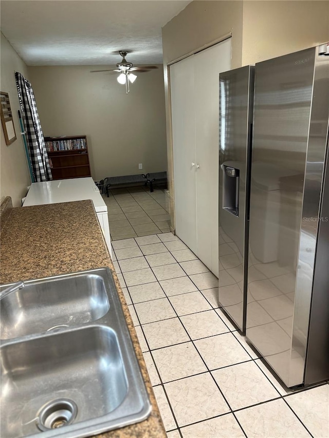 5549 NW 64th St, Ocala, FL 34482 - kitchen with stainless steel fridge, a sink, a ceiling fan, and light tile patterned floors
