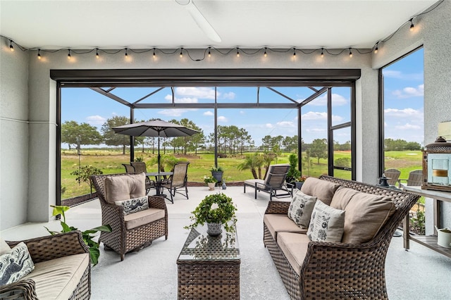 8606 SW 61st Loop, Ocala, FL 34481 - sunroom with track lighting and an outdoor hangout area