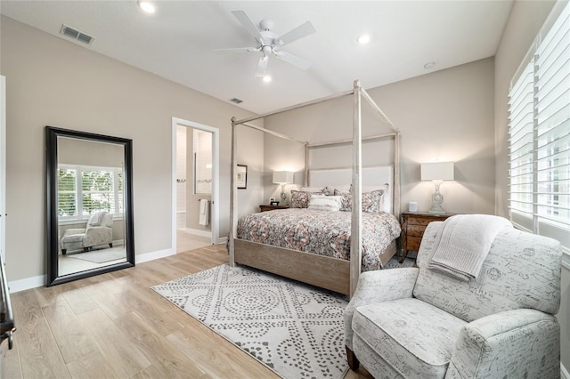 8606 SW 61st Loop, Ocala, FL 34481 - bedroom with light wood-style flooring, recessed lighting, baseboards, ensuite bath, and ceiling fan