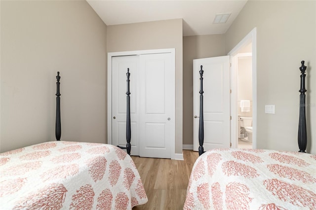 8606 SW 61st Loop, Ocala, FL 34481 - bedroom with light wood finished floors, a closet, and baseboards
