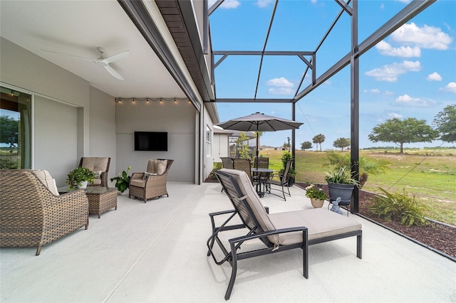 8606 SW 61st Loop, Ocala, FL 34481 - view of patio with ceiling fan, an outdoor hangout area, and glass enclosure